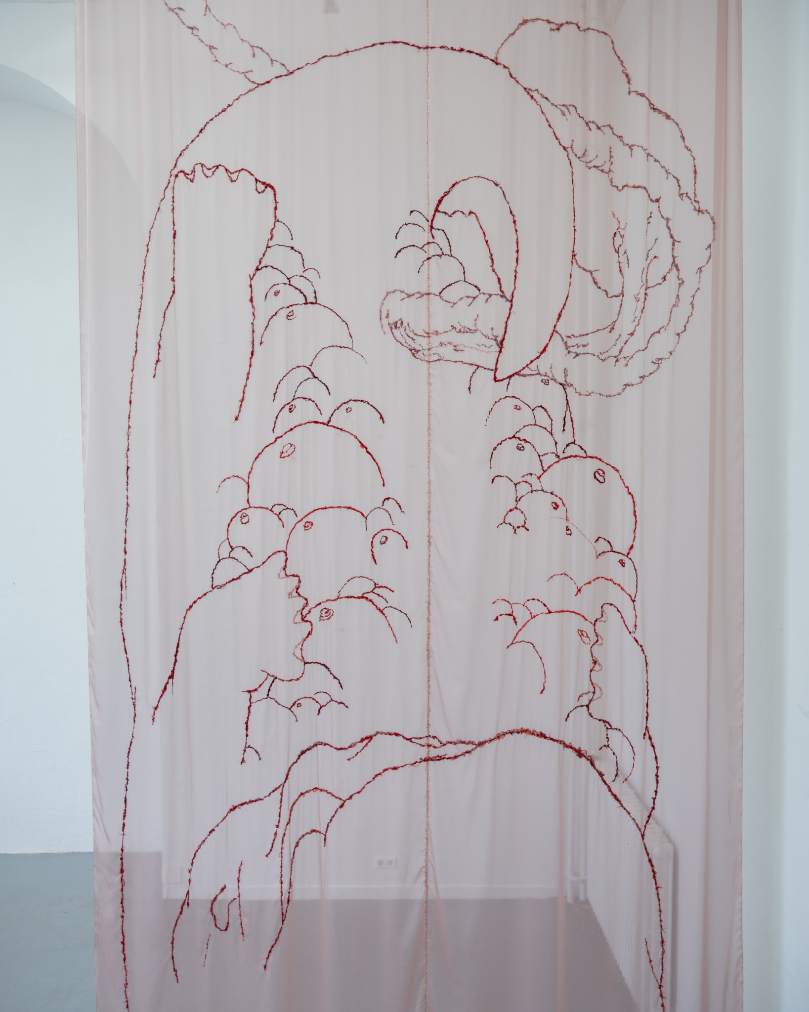 Upper section of the embroidered embryo pattern