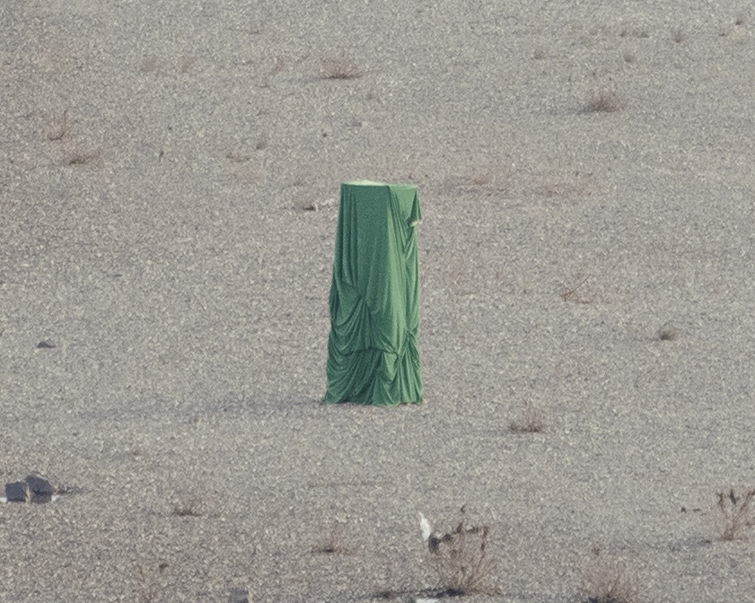 Temporary Monument seen at close range on the gravel bank